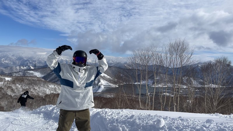 Snowboarding in the mountains in a helmet and goggles